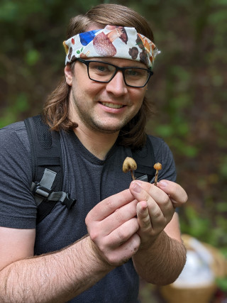 Alexander Bradshaw holding fungi.
